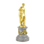 AFTER THORWALDSEN; a Belle Èpoque era gilded bronze of Eve holding a forbidden fruit,