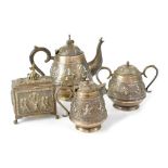 A late 19th/early 20th century Indian three-piece white alloy metal tea set comprising a teapot