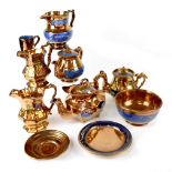A quantity of 19th century copper lustre pottery to include teapots, large water jug,