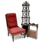 An Edwardian oak-framed nursing chair with button back red upholstery,