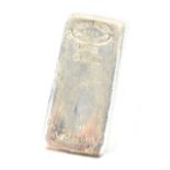 A 1kg silver ingot marked 'Johnson Matthey London 9990 1 Kilo Silver JM 69501A'.