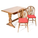 A 20th century oak draw-leaf table with country-style carved slab end supports to cross-stretcher,