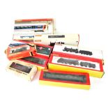 A group of nine Hornby OO model railway items to include engines with tender and rolling stock,