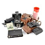 A small collection of vintage cameras and accessories.