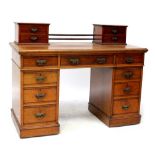 An Edwardian mahogany desk, converted from a dressing table,