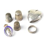 A Victorian hallmarked silver vesta in the form of a heart, initialled WFW, three silver thimbles,