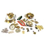 A quantity of mainly British military and naval buttons and various military cap badges to include