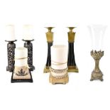 A group of seven various decorative pillar candle stands to include a pair of Greek column examples,