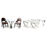 A contemporary circular bevelled glass topped dining table on quadripartite chrome base,