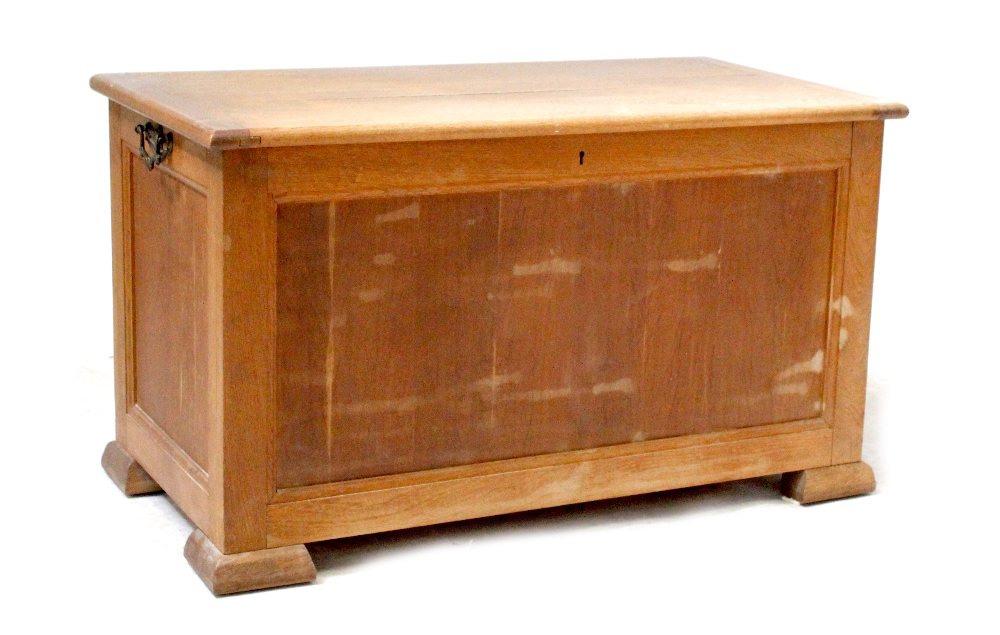 A modern oak blanket box with fielded panels, on block feet, height 55cm, width 96cm, depth 51cm.