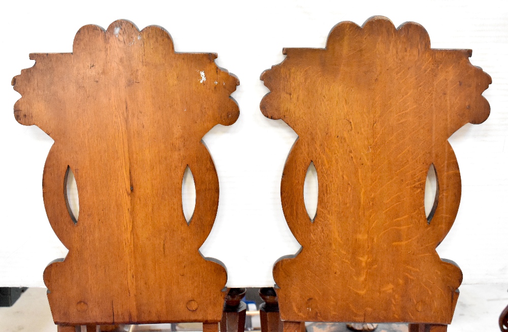 A pair of 19th century oak hall chairs, the backs with carved circular motifs, - Image 2 of 4