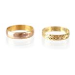 Two 9ct gold band rings to include one with repeating arrow pattern, both size O, combined approx 3.