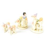 A pair of Lenox porcelain 'Snow White and the Seven Dwarfs' candlesticks and two pairs of cruets,
