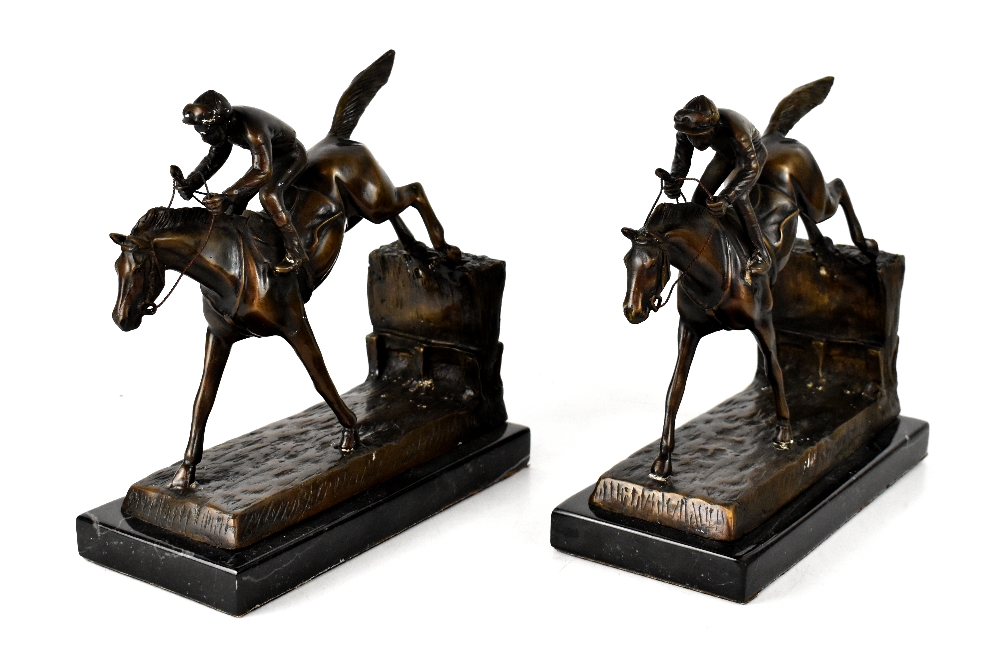 UNATTRIBUTED; a pair of bronze figures of jockeys in full race mode,