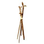 A collection of seven 20th century walking canes to include an example with fox head,