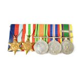 A group of four WWII medals comprising the Italy Star, 1939-45 Star,