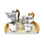A Picquot ware tea and coffee set comprising tea pot, coffee pot, cream and sugar and tray.