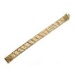 A 9ct gold three-coloured articulated link bracelet stamped 375, approx 20.9g.