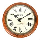 Sewill, Liverpool; a large oak wall clock with a painted and signed dial set with Roman numerals,