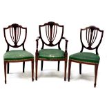 Three matching Regency-style mahogany dining chairs to include one carver,