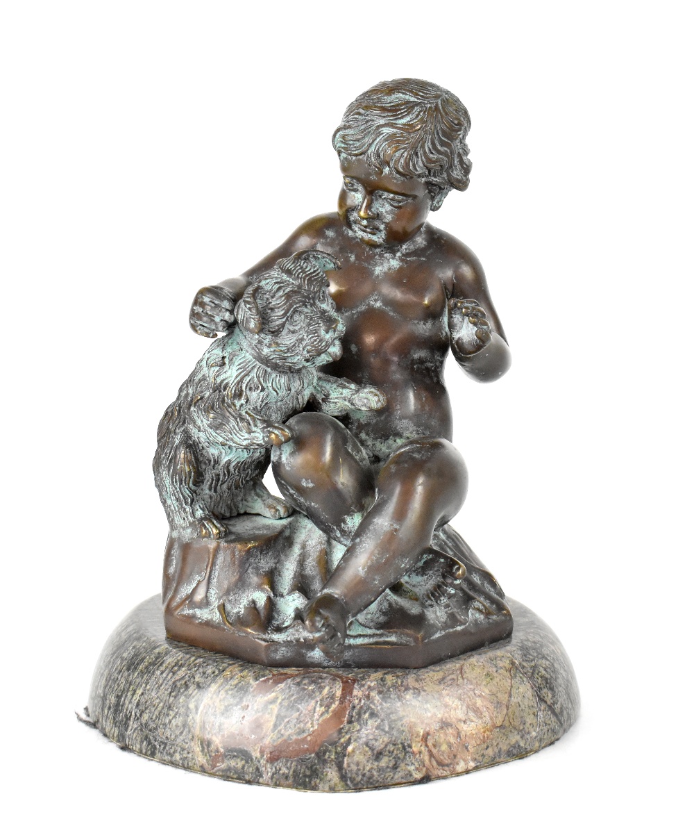 A bronze figure of a young child with puppy, on a stylised grassy plinth to circular marble base,