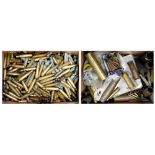 A large collection of used brass cartridge cases of various shapes, sizes and conditions.