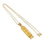 A 9ct gold necklace, length approx 40cm, with gold Egyptian panel pendant with vertical hieroglyphs,