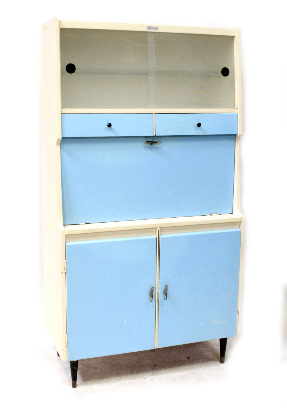 A retro c1950s Esto kitchen cabinet, twin glazed sliding doors to the top,