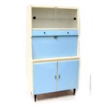 A retro c1950s Esto kitchen cabinet, twin glazed sliding doors to the top,