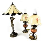 A set of four matching table lamps in the form of oil lamps,
