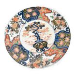 An Oriental Imari palette charger, hand painted with symbolic Chinese prunus blossom,