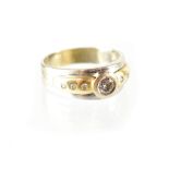 A gentlemen's extra-large white 14K gold ring, the applied yellow shoulder set with white stones,