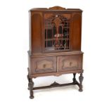 A reproduction sapele display cabinet,