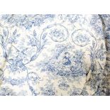 A quantity of French cream and blue Toile de Jouy fabric curtains, lined and interlined,