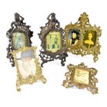 Five vintage brass photo frames in the Classical style to include a pair of frames decorated with a