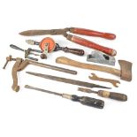 A collection of vintage garden tools to include scythe, gardening shears, various hammers, files,