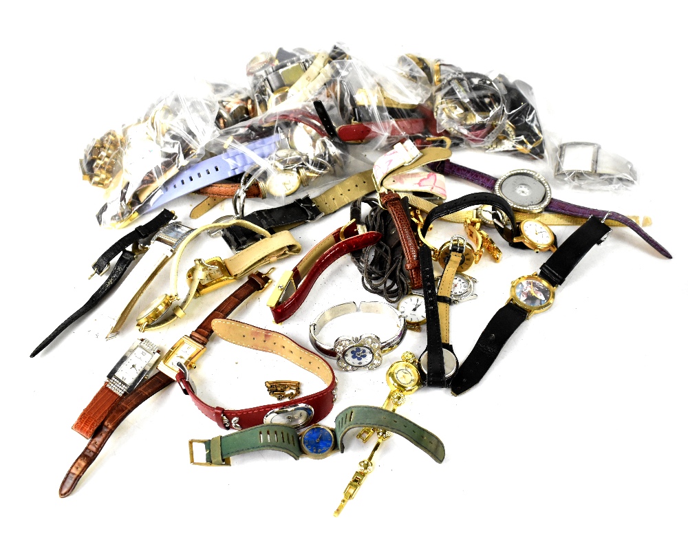 A quantity of ladies' and gentlemen's fashion watches, various names to include Trophy,