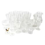 A quantity of cut glass drinking glasses to include wine glasses.