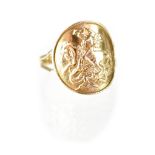 A gentlemen's hallmarked 9ct gold ring with curved George and the Dragon panel, size R, approx 3.8g.