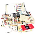 A quantity of stamps and first day covers to include an album of world stamps,