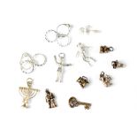 Twelve various sterling silver charms to include a deep sea diver, a Toby jug and a squirrel (12).