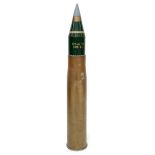 A 105mm brass artillery shell case with 105mm 'TK SMK BE' projectile with mechanical timer,