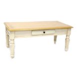 A modern country-style pine-effect coffee table with cream painted base, length 117cm.