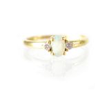 An 18ct yellow gold opal and diamond ring,