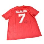 SIR KENNY DALGLIESH; a replica Liverpool football shirt when sponsored by Crown Paints,