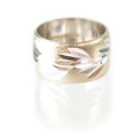A 9ct white gold wedding band with etched leaf decoration on a matt ground, stamped 375, size M,