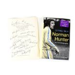 LEEDS UNITED; a signed book page with autographs of Don Revie, Billy Bremner, John Giles,