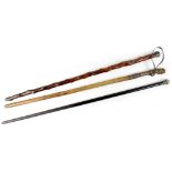 A Howell of London early 20th century sword stick walking cane with white metal handle cap,