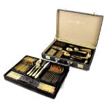 A Bestecke Solingen white metal and gilded canteen of cutlery held within a black leather-style