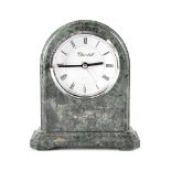 A Churchill green marble mantel clock with Art Deco inscribed stepped plinth base,